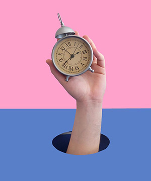 Hand with clock - time change